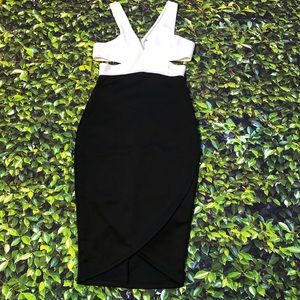 New black and white dress with side cut out detail and front slit . No tag